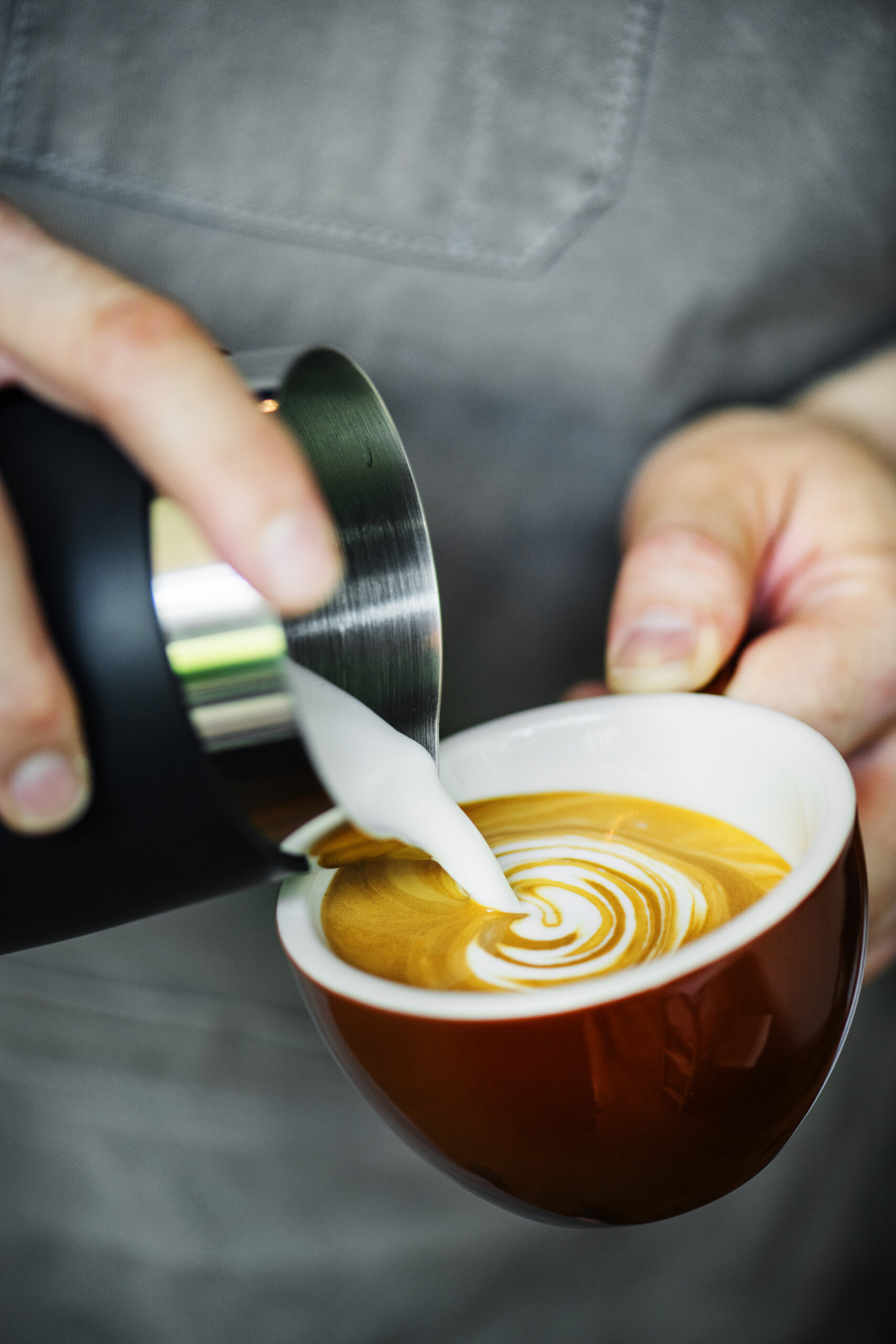 Closeup of barista making latte art